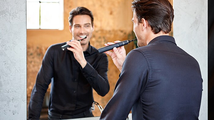 Man brushing teeth