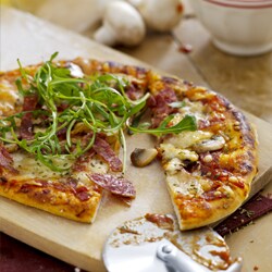 Pizza with salami, mozzarella and olives